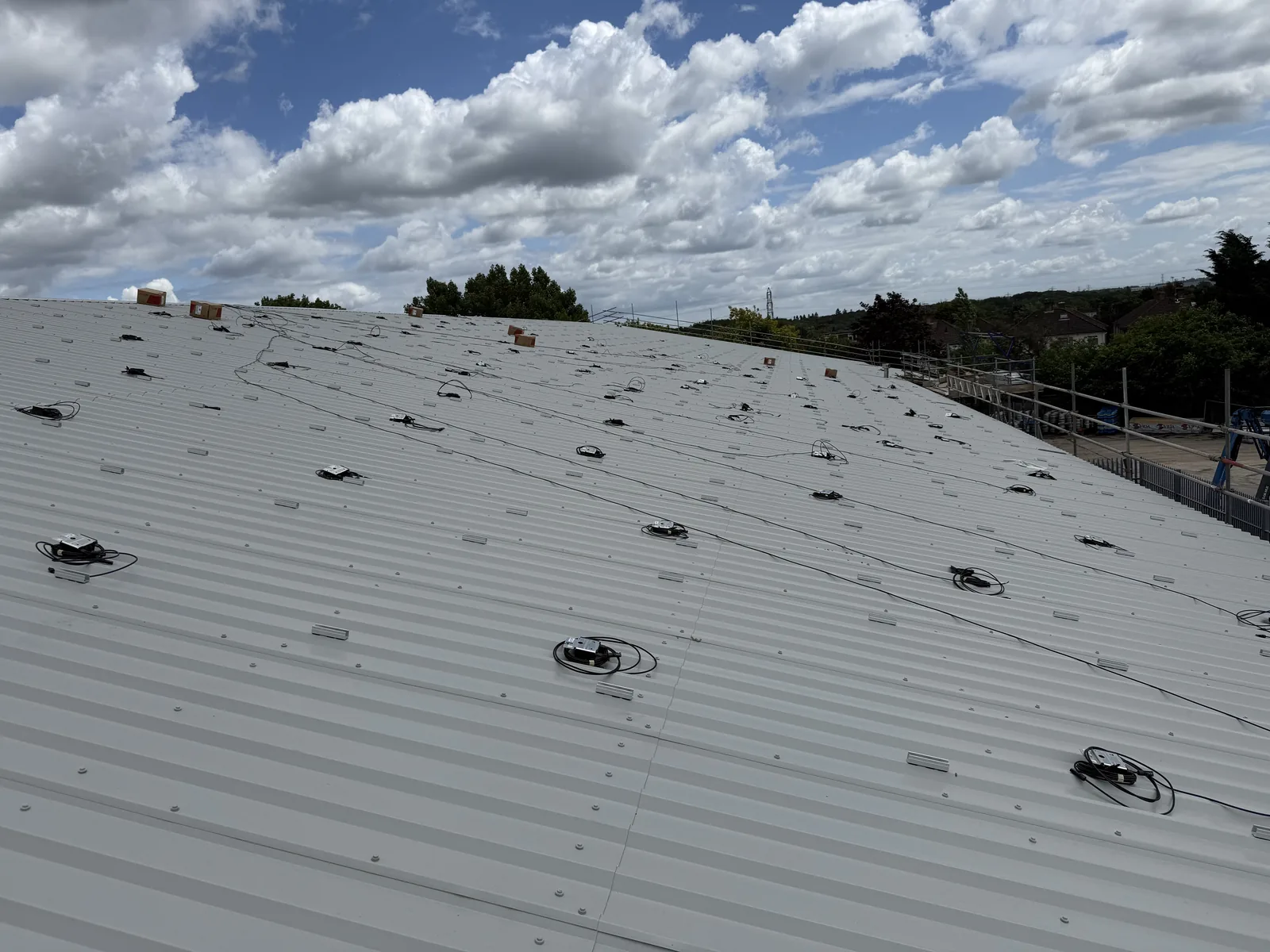 Solar optimisers and cabling fixed out across the new metal roof