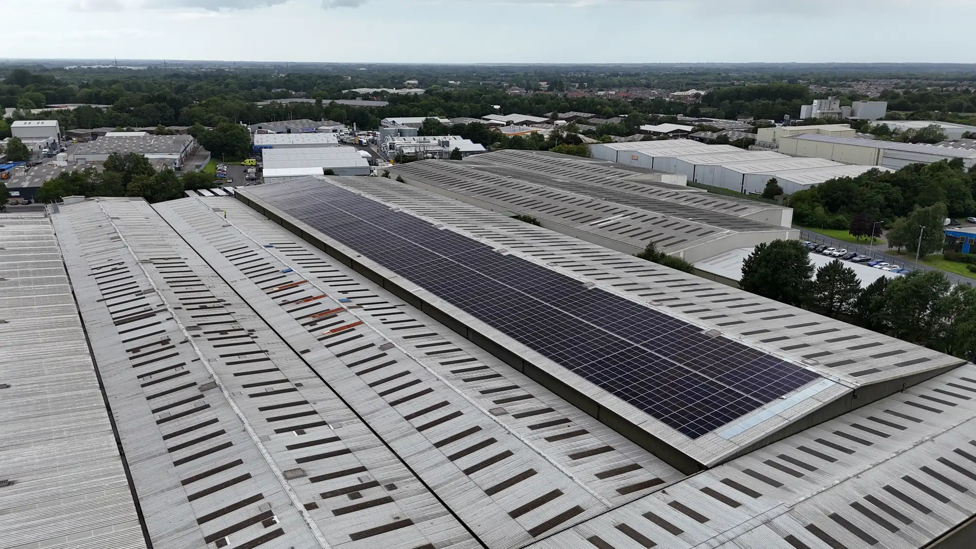 Drone view of solar panels on the FDC warehouse roof within an industrial estate