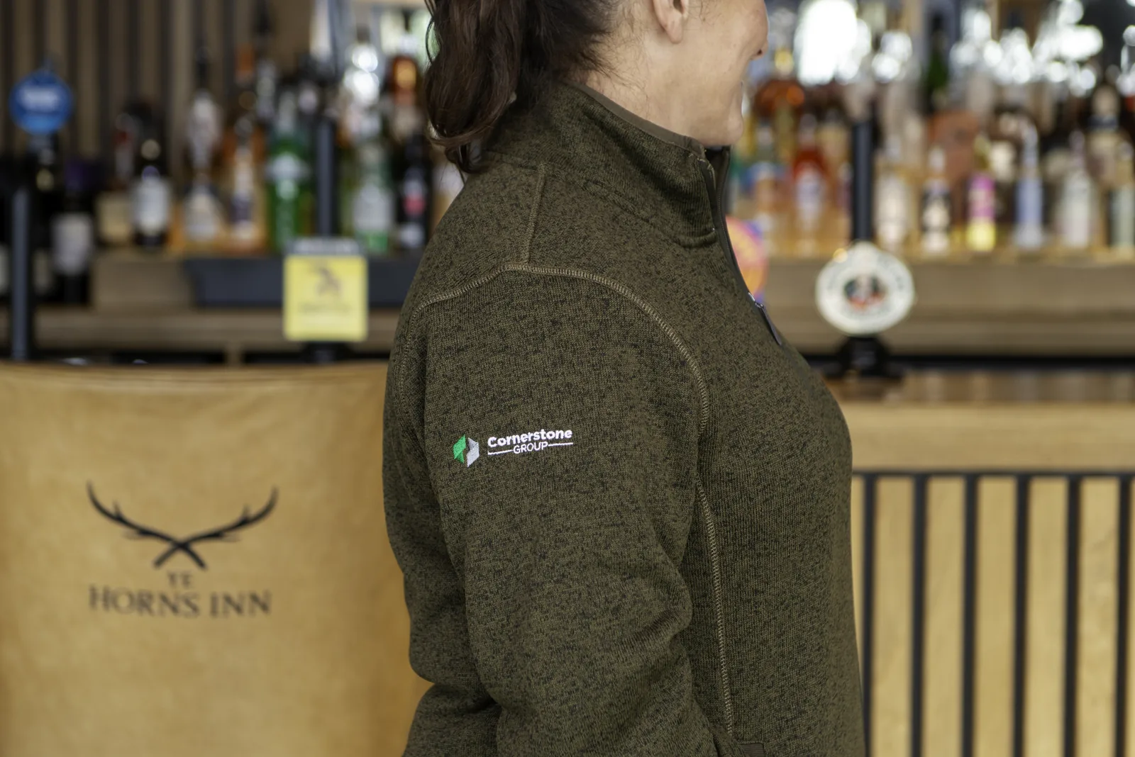 Bar at Ye Horns Inn with the inn's stag logo, Cornerstone fleece in foreground