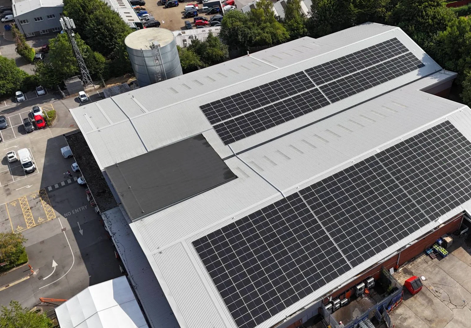 Large rooftop solar arrays on the re-roofed Booker Watford warehouse