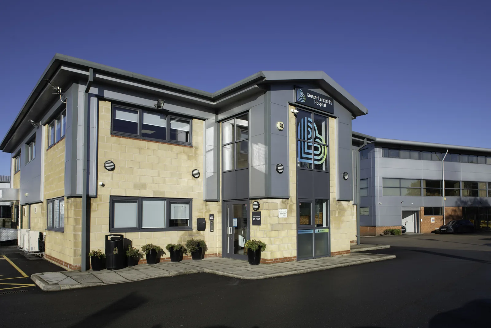 Corner view of Greater Lancashire Hospital showing both elevations