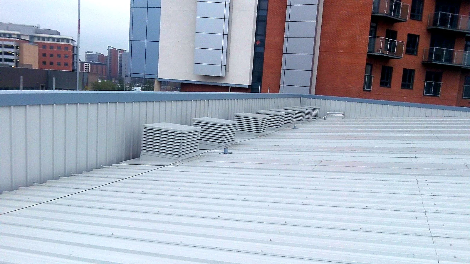 New metal roof with louvred plant enclosures on a Leeds data centre